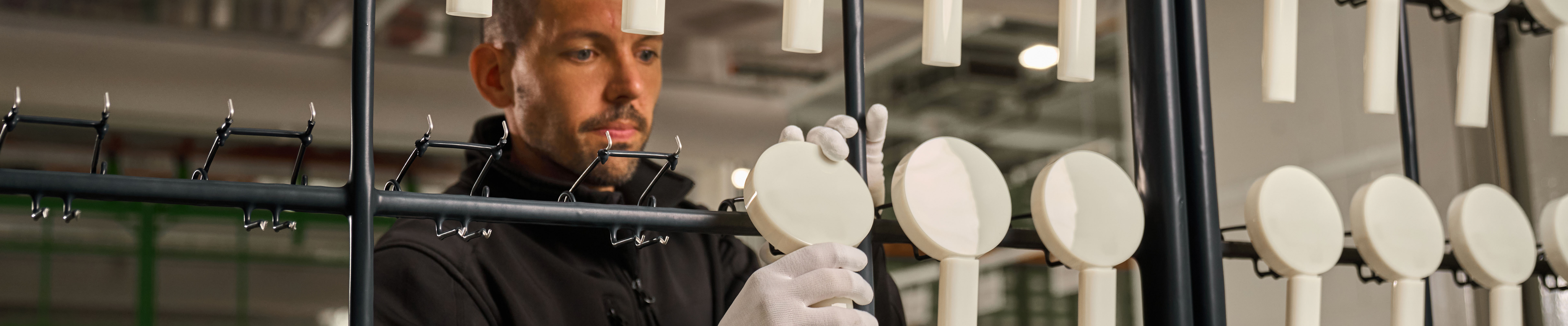 Man testing showers in a hansgrohe production facility.