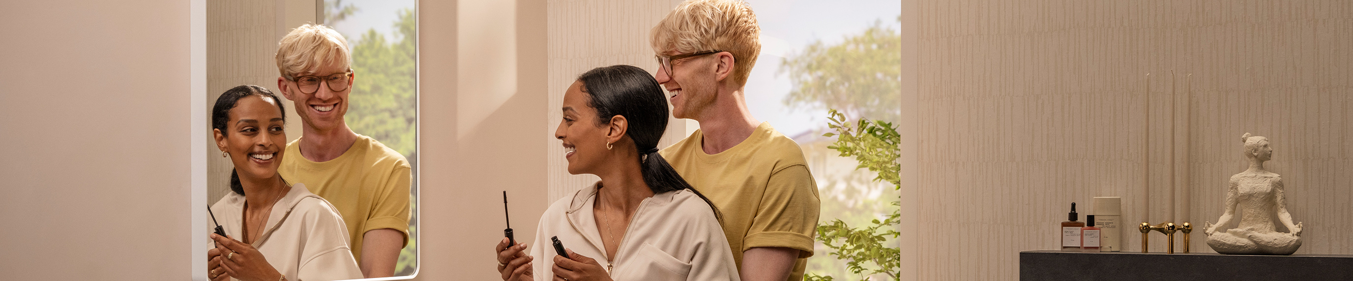 Happy couple looks in the Xarita Lite Q mirror.